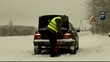 Man keep towing rope near car