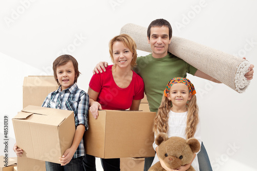 Photo: Happy family moving into a new home Happy family moving into a new home