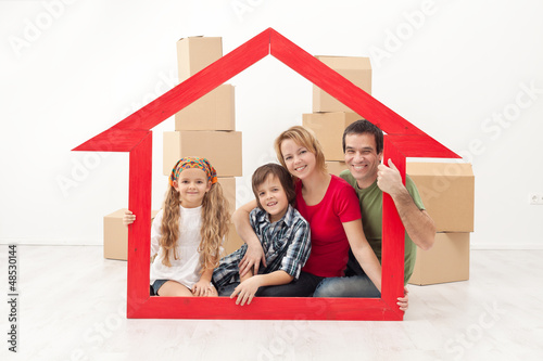 Photo: Happy family moving into a new home Happy family moving into a new home