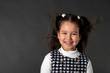 charming girl with flying hair and dimples on her cheeks