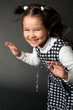 charming girl with flying hair and dimples on her cheeks