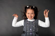 charming girl with flying hair and dimples on her cheeks