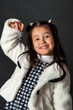 charming girl with flying hair and dimples on her cheeks