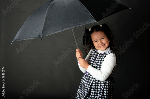 Photo: charming girl with flying hair and dimples on her cheeks charming girl with flying hair and dimples on her cheeks