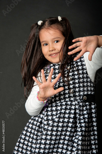 Photo: charming girl with flying hair and dimples on her cheeks charming girl with flying hair and dimples on her cheeks