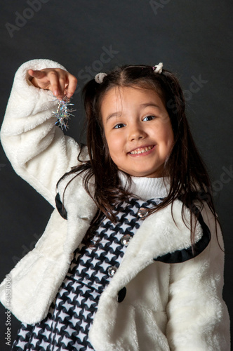 Photo: charming girl with flying hair and dimples on her cheeks charming girl with flying hair and dimples on her cheeks