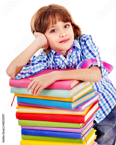 Photo: Child with stack of books. Child with stack of books.