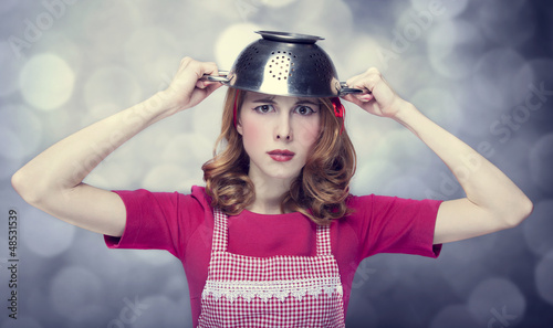 Photo: Redhead housewife with colander over head Redhead housewife with colander over head