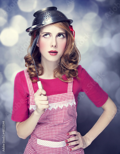Photo: Redhead housewife with soup ladle Redhead housewife with soup ladle