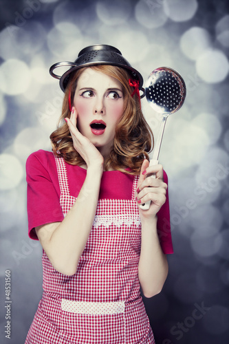 Photo: Redhead housewife with soup ladle Redhead housewife with soup ladle