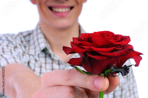 Photo: young boy with a flower in your hand young boy with a flower in your hand