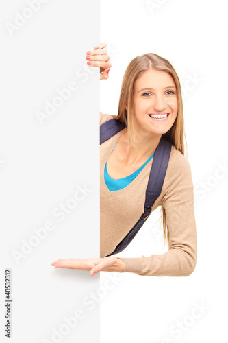 Photo: A smiling female student gesturing on a panel A smiling female student gesturing on a panel