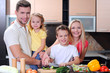 family cooking together in the kitchen