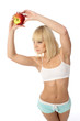Athletic girl offering an apple