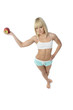 Athletic girl offering an apple