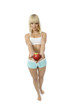 Athletic girl offering an apple