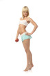 Athletic girl offering an apple