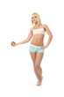 Athletic girl offering an apple