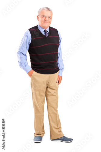 Photo: Full length portrait of a happy gentleman posing Full length portrait of a happy gentleman posing