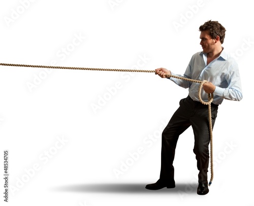 Photo: Businessman pulling rope Businessman pulling rope