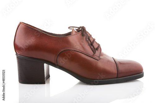 Photo: Vintage female shoe isolated on white Vintage female shoe isolated on white