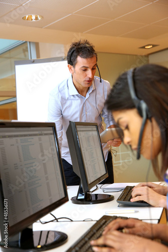 Photo: Helpline manager in training with young people Helpline manager in training with young people