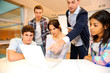 Group of students in computer training with teacher