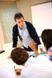 College teacher in class with group of students