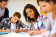 Group of teenagers in class writing an exam