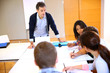 College teacher in class with group of students