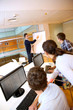Teacher in lab doing presentation on whiteboard