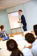 Photo: College teacher in class with group of students College teacher in class with group of students