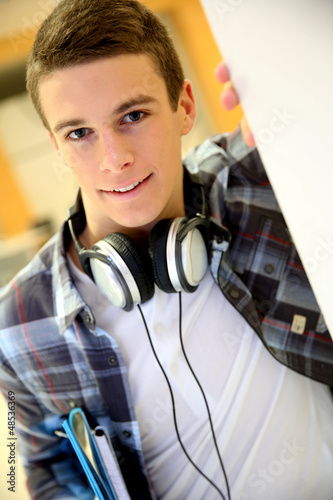 Photo: Trendy young student boy with music headphones Trendy young student boy with music headphones