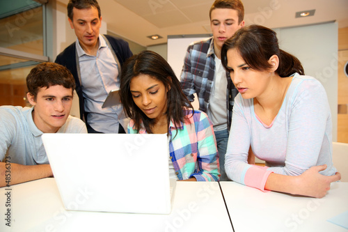 Photo: Group of students in computer training with teacher Group of students in computer training with teacher