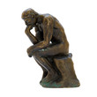 Antique bronze figurine of the naked thinker man.