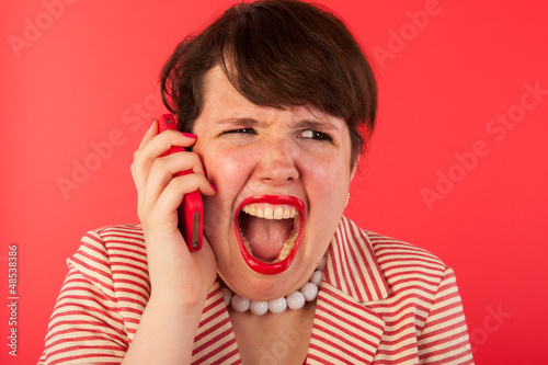 Photo: Angry phone call on the smartphone Angry phone call on the smartphone