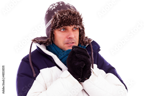 Photo: Young man rubbing his hands from cold Young man rubbing his hands from cold