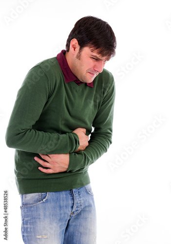 Photo: Young man with strong stomach pain Young man with strong stomach pain