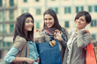 Three Beautiful Young Women with Shopping Bags