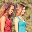 Two Beautiful Teenage Girls Walking at Park