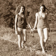 Two Beautiful Teenage Girls Walking at Park