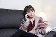 A young woman talking on the phone