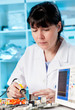 Tech tests electronic equipment