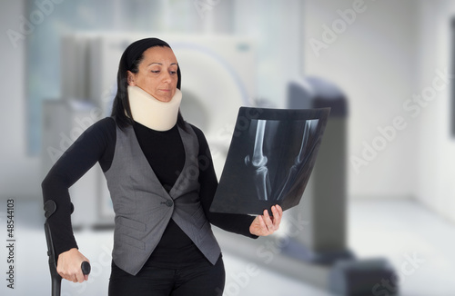 Photo: Woman with cervical collar and radiography Woman with cervical collar and radiography