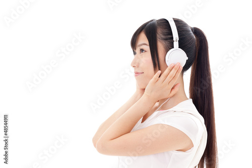 Photo: attractive asian woman listening music attractive asian woman listening music