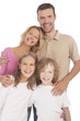 Foto: four happy caucasian family members standing together and smilin four happy caucasian family members standing together and smilin