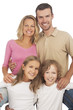 Foto: happy caucasian family standing together and smiling happily happy caucasian family standing together and smiling happily