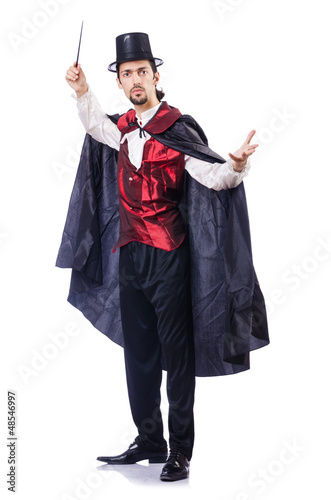 Photo: Magician with his magic wand on white Magician with his magic wand on white