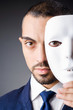 Man with masks in hypocrisy concept