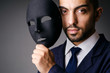 Man with black mask in studio